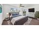 Spacious main bedroom with sliding glass doors and large windows offering plenty of natural light at 3640 Ironwood Cir # 302N, Bradenton, FL 34209