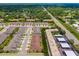 An expansive aerial view showing the neighborhood layout, nearby roads, and the abundance of green spaces at 3673 Fescue Ln, Sarasota, FL 34232