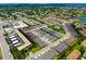 Aerial shot displays the vast community layout including pools, townhomes, and commercial development in the surrounding area at 3673 Fescue Ln, Sarasota, FL 34232