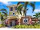 Inviting two-story building with mixed exterior, palm trees, and meticulously maintained landscaping at 3673 Fescue Ln, Sarasota, FL 34232