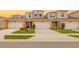 Charming townhome featuring a two-car garage, brick driveway, and well-manicured landscaping in a vibrant community at 3673 Fescue Ln, Sarasota, FL 34232