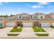 Beautiful townhomes boast manicured lawns, brick driveways, and colorful flowerbeds adding curb appeal at 3673 Fescue Ln, Sarasota, FL 34232