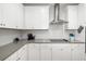 Close-up of a stylish kitchen featuring stainless steel appliances and ample counter space at 3673 Fescue Ln, Sarasota, FL 34232