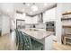 Open kitchen features a large island, stainless steel appliances, and modern finishes at 3673 Fescue Ln, Sarasota, FL 34232