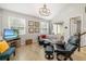 Comfortable living room with a leather recliner, modern decor, and natural light streaming through the windows at 3673 Fescue Ln, Sarasota, FL 34232