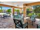 Relaxing outdoor patio featuring comfortable seating, stone pillars, and ample shade at 3673 Fescue Ln, Sarasota, FL 34232