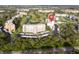 Aerial view displaying the condo, surrounding greenery, golf course, water feature, and convenient parking at 3680 Ironwood Cir # 603L, Bradenton, FL 34209