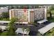 View of condo building showing parking and surrounding trees at 3680 Ironwood Cir # 603L, Bradenton, FL 34209