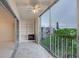 Balcony with built in shelving and electric fireplace with a ceiling fan at 3680 Ironwood Cir # 603L, Bradenton, FL 34209