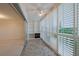 The balcony features a ceiling fan and shuttered windows offering great views with a built-in bookshelf at 3680 Ironwood Cir # 603L, Bradenton, FL 34209