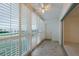Enclosed balcony with shutter windows offering ample light and outdoor space at 3680 Ironwood Cir # 603L, Bradenton, FL 34209