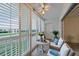 Inviting balcony featuring shutter windows, ceiling fan and outdoor seating at 3680 Ironwood Cir # 603L, Bradenton, FL 34209