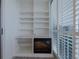 Balcony with built-in shelving and electric fireplace with a view of the outdoors at 3680 Ironwood Cir # 603L, Bradenton, FL 34209