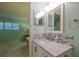 Updated bathroom with tiled backsplash and modern vanity at 3680 Ironwood Cir # 603L, Bradenton, FL 34209