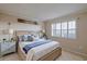 Comfortable bedroom features neutral tones, wood accents, and bright natural light at 3680 Ironwood Cir # 603L, Bradenton, FL 34209