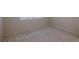 Bedroom with neutral carpet, light paint, and a window providing natural light at 3680 Ironwood Cir # 603L, Bradenton, FL 34209