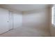Cozy bedroom with neutral walls, closet, and bright window at 3680 Ironwood Cir # 603L, Bradenton, FL 34209