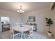 Elegant dining room boasts a round table, stylish decor, and abundant natural light for gatherings at 3680 Ironwood Cir # 603L, Bradenton, FL 34209