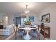 Dining room with a modern light fixture and seating for four at 3680 Ironwood Cir # 603L, Bradenton, FL 34209