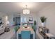 Open-concept dining area with seating for six, modern decor, and neutral finishes at 3680 Ironwood Cir # 603L, Bradenton, FL 34209