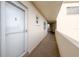 Hallway entrance to unit featuring a tiled floor, fresh paint and lots of natural light at 3680 Ironwood Cir # 603L, Bradenton, FL 34209