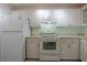 Kitchen with white appliances and ample cabinet space at 3680 Ironwood Cir # 603L, Bradenton, FL 34209