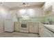 Kitchen with white cabinets and appliances at 3680 Ironwood Cir # 603L, Bradenton, FL 34209
