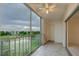Inviting lanai with golf course view, shutters, and tiled floors at 3680 Ironwood Cir # 603L, Bradenton, FL 34209
