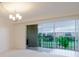 Bright living room with a view to the exterior through the sliding doors and window coverings at 3680 Ironwood Cir # 603L, Bradenton, FL 34209