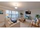 Inviting living room with balcony access, comfortable seating, and a modern entertainment area at 3680 Ironwood Cir # 603L, Bradenton, FL 34209