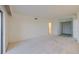 Neutral-colored room with light carpet offers views of the unit's hallway and doorways at 3680 Ironwood Cir # 603L, Bradenton, FL 34209