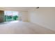 Large living room with a balcony offering outdoor view at 3680 Ironwood Cir # 603L, Bradenton, FL 34209