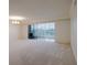 Spacious living room with sliding glass doors to the balcony provide lots of natural light at 3680 Ironwood Cir # 603L, Bradenton, FL 34209