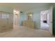 The main bedroom boasts a view into another room, dresser, and large closets at 3680 Ironwood Cir # 603L, Bradenton, FL 34209