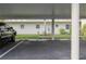 Assigned covered parking featuring space number and convenient access to the building at 3680 Ironwood Cir # 603L, Bradenton, FL 34209