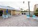 Community patio with tables, chairs, umbrellas, and grills for resident use and relaxation at 3680 Ironwood Cir # 603L, Bradenton, FL 34209
