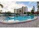 Inviting in-ground pool with poolside seating and manicured grounds, offering residents a relaxing outdoor experience at 3680 Ironwood Cir # 603L, Bradenton, FL 34209