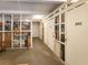 Storage units featuring metal doors and cages in a well-lit hallway at 3680 Ironwood Cir # 603L, Bradenton, FL 34209