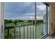 Enjoy the scenic view of the lush golf course and water from the screened balcony at 3680 Ironwood Cir # 603L, Bradenton, FL 34209