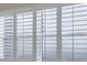 Close up on white window with interior white shutters, creating privacy and style at 3680 Ironwood Cir # 603L, Bradenton, FL 34209