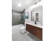 Sleek bathroom featuring a modern vanity, soaking tub, and tiled shower at 4041 Linwood St, Sarasota, FL 34232