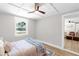 Bright bedroom with wood floors, ceiling fan, and neutral paint at 4041 Linwood St, Sarasota, FL 34232
