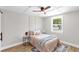 Cozy bedroom with coffered ceiling, wood floors, and natural light at 4041 Linwood St, Sarasota, FL 34232