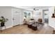 Inviting living room featuring light walls, modern furniture, wood-look floors, and ample sunlight at 4041 Linwood St, Sarasota, FL 34232