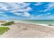 Beautiful beach with white sand, blue sky, and gentle waves at 500 Park S Blvd # 97, Venice, FL 34285