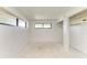 Bedroom featuring two windows, white walls, and closet shelving at 500 Park S Blvd # 97, Venice, FL 34285