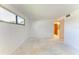 Bright bedroom with large window, featuring a view into a partially renovated interior at 500 Park S Blvd # 97, Venice, FL 34285