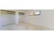 Bright bedroom features a window, built-in closet and ample space for personalization and comfort at 500 Park S Blvd # 97, Venice, FL 34285