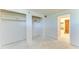 Bedroom featuring closet shelving, white walls, and doorway to another room at 500 Park S Blvd # 97, Venice, FL 34285
