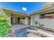 Carport with ample space, storage racks, and attached to a well-kept home in a quiet neighborhood at 500 Park S Blvd # 97, Venice, FL 34285